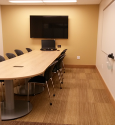 Picture of a larger study room with widescreen monitor.