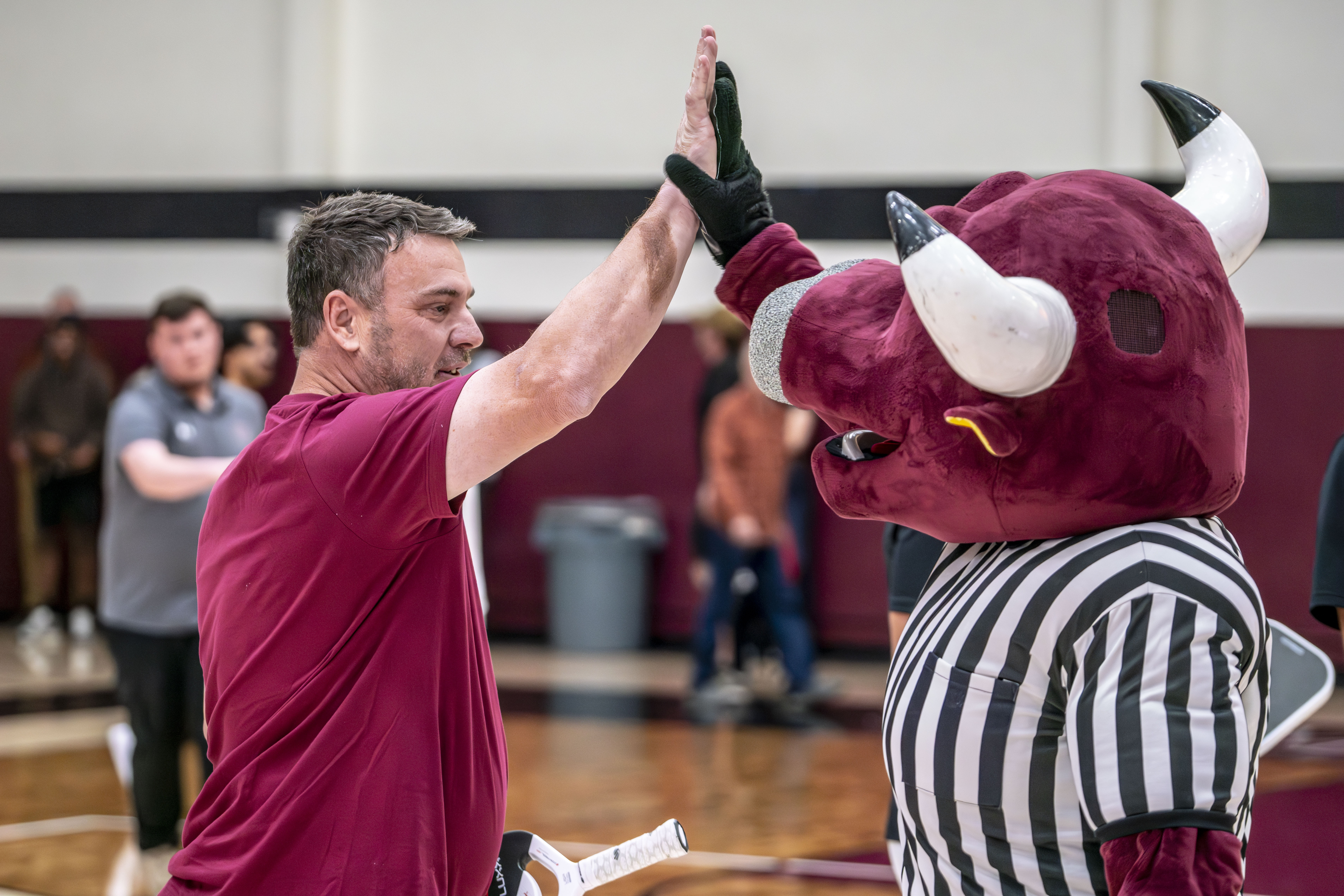 Canvas Credit Union CEO Chad Shane celebrating pickleball victory with Rowdy