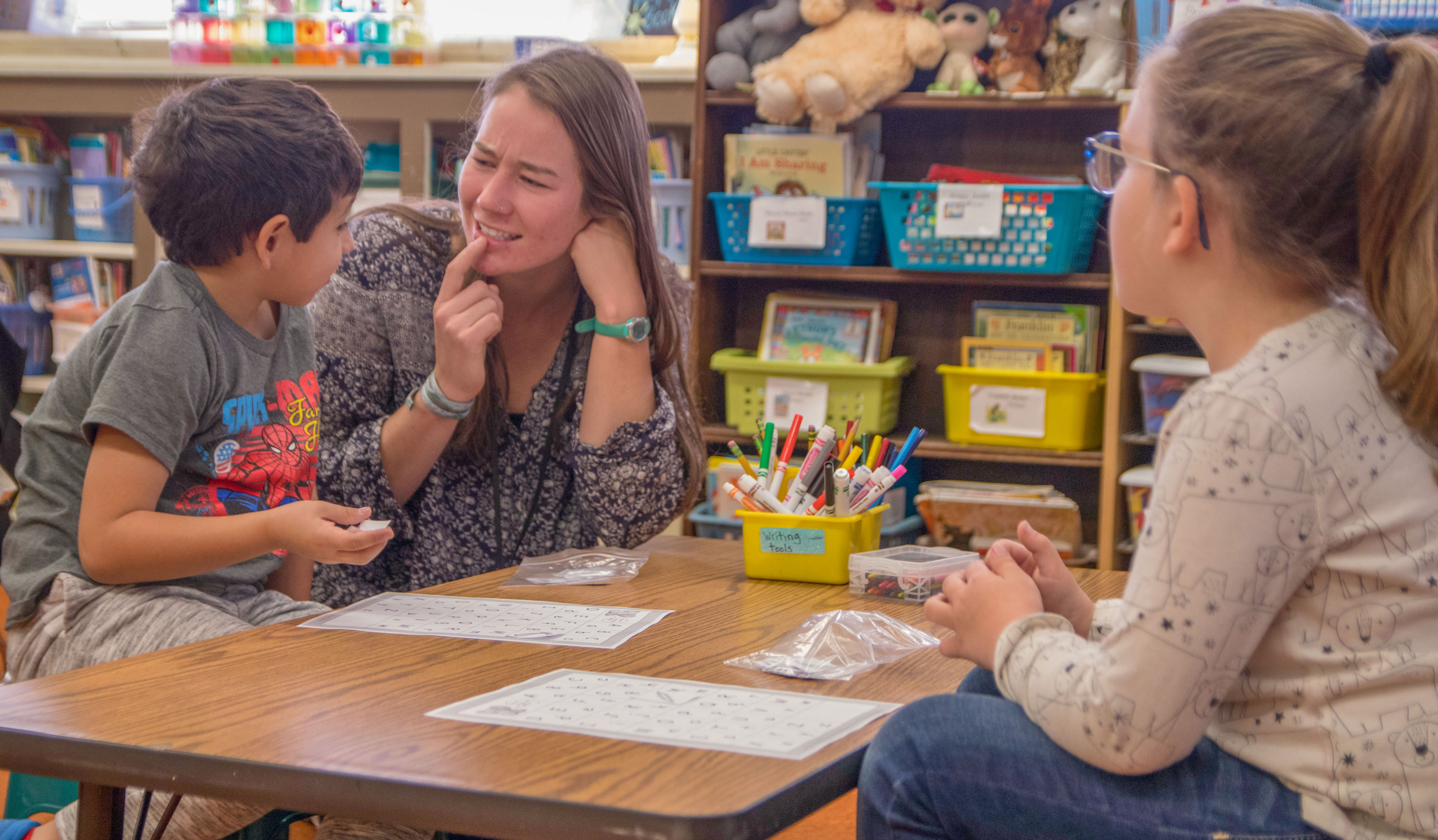 student teacher with children in a classroom